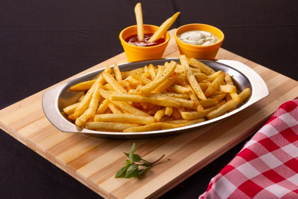 portion-french-fries-silver-bowl-top-wooden-board-with-checkered-fabric